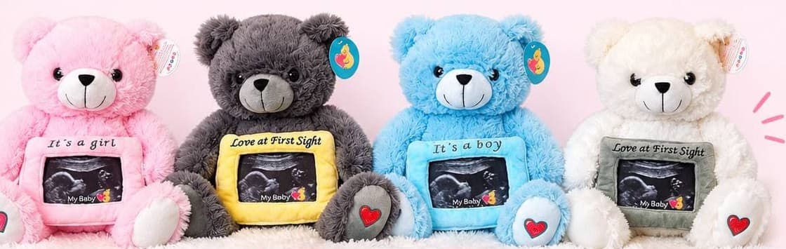 Four Heartbeat Bears in pink, gray, blue and white, each holding an ultrasound photo frame